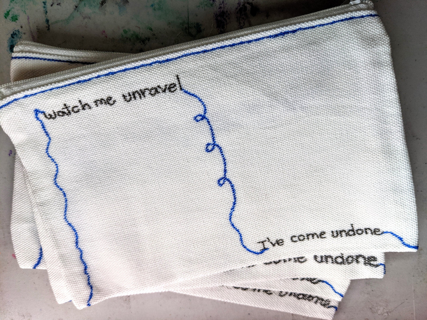 Weezer - The Sweater Song - zipper pouch - Watch me unravel - village of the weird