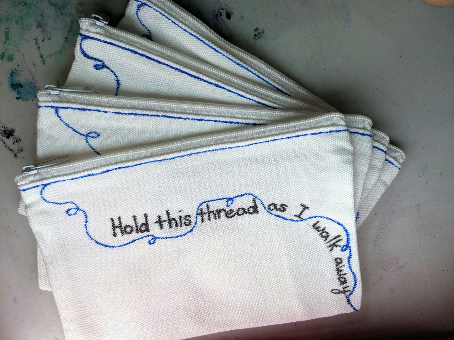 Weezer - The Sweater Song - zipper pouch - Watch me unravel - village of the weird